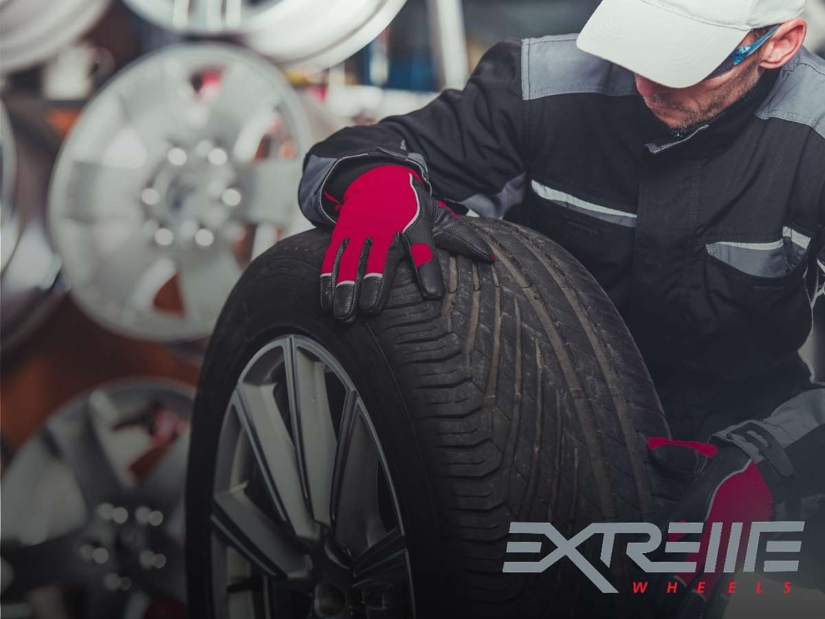 Man Changing Tires For a New Set Of Tires